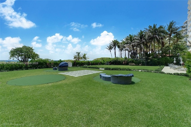 9455 Collins Ave Unit 301, Surfside, FL 33154 - view of home's community with a lawn and a putting area