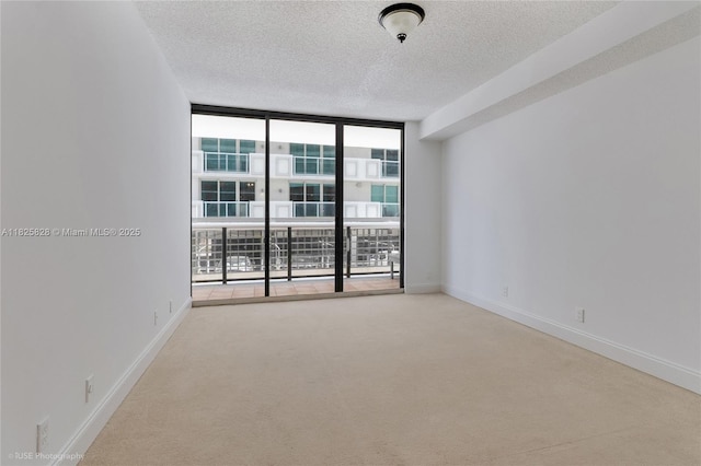 9455 Collins Ave Unit 301, Surfside, FL 33154 - carpeted empty room with floor to ceiling windows and a textured ceiling