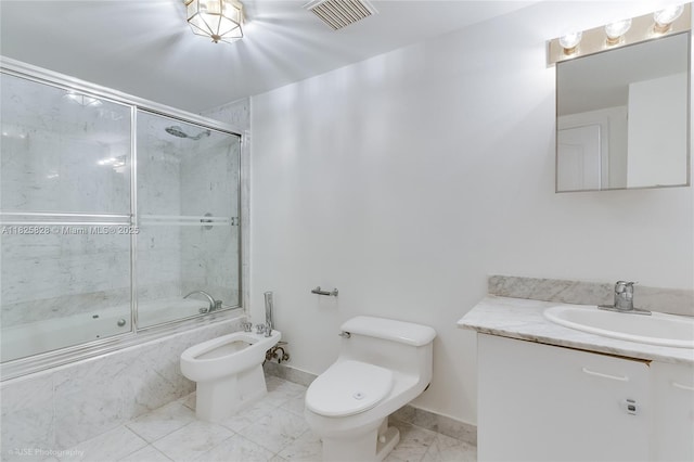 9455 Collins Ave Unit 301, Surfside, FL 33154 - bathroom with a bidet, shower / bath combination with glass door, vanity, and marble finish flooring