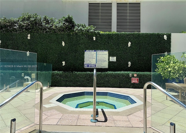 9455 Collins Ave Unit 301, Surfside, FL 33154 - view of pool with a hot tub