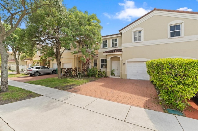 3818 SW 171st Ter, Miramar, FL 33027 - multi unit property featuring a tiled roof, stucco siding, decorative driveway, and an attached garage