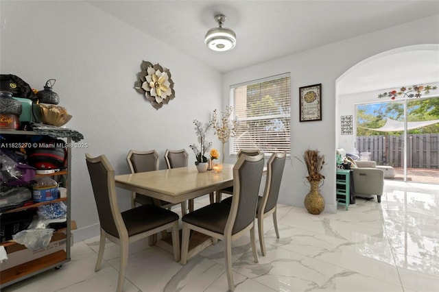 3818 SW 171st Ter, Miramar, FL 33027 - dining space with healthy amount of natural light, arched walkways, and light marble finish floors