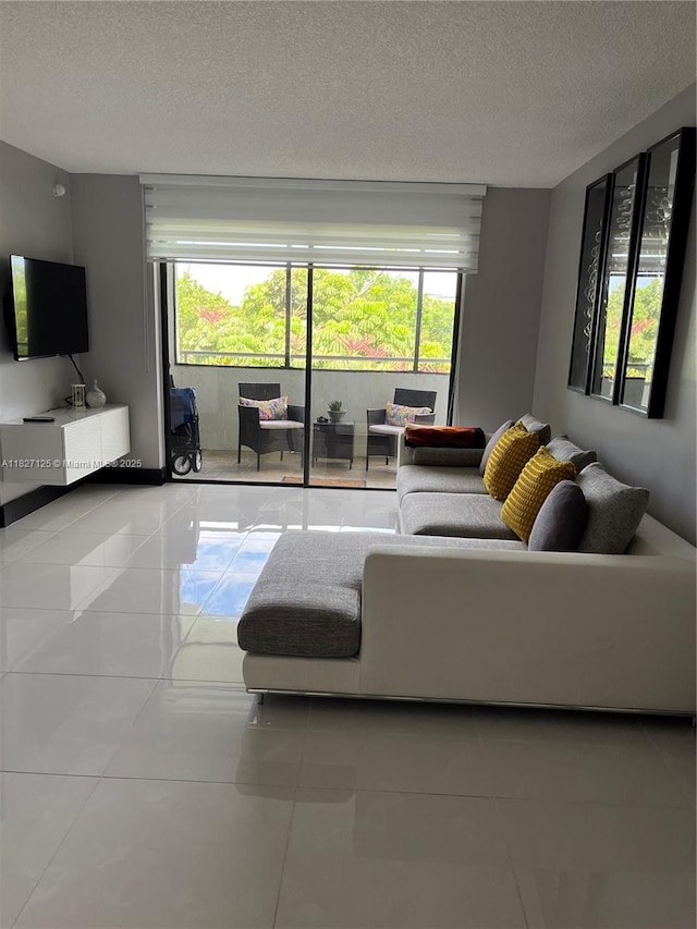 8215 SW 152nd Ave Unit G-307, Miami, FL 33193 - tiled living area with a textured ceiling