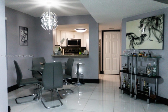 8215 SW 152nd Ave Unit G-307, Miami, FL 33193 - dining room with baseboards and light tile patterned floors