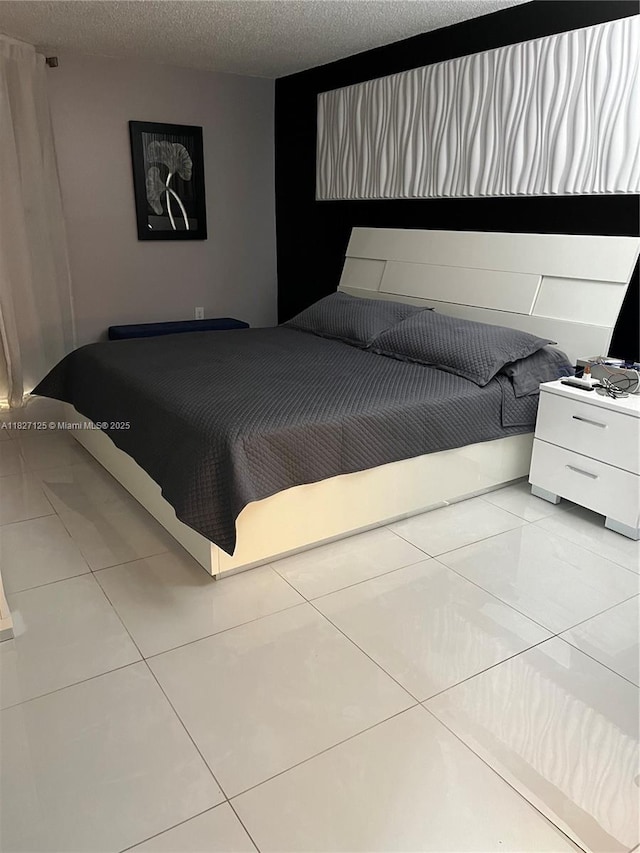 8215 SW 152nd Ave Unit G-307, Miami, FL 33193 - bedroom with light tile patterned floors and a textured ceiling