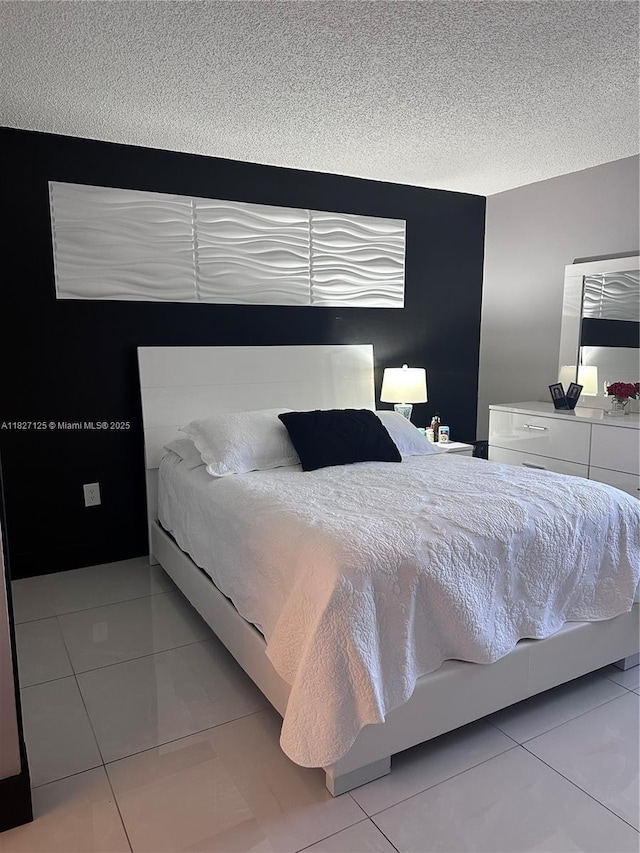 8215 SW 152nd Ave Unit G-307, Miami, FL 33193 - bedroom with light tile patterned flooring and a textured ceiling
