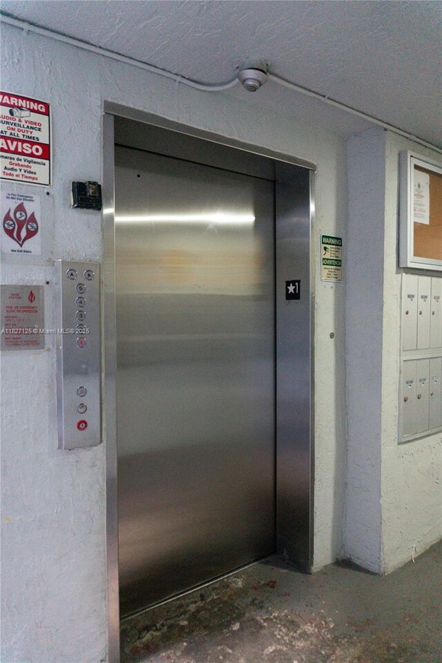 8215 SW 152nd Ave Unit G-307, Miami, FL 33193 - elevator with concrete flooring and mail area