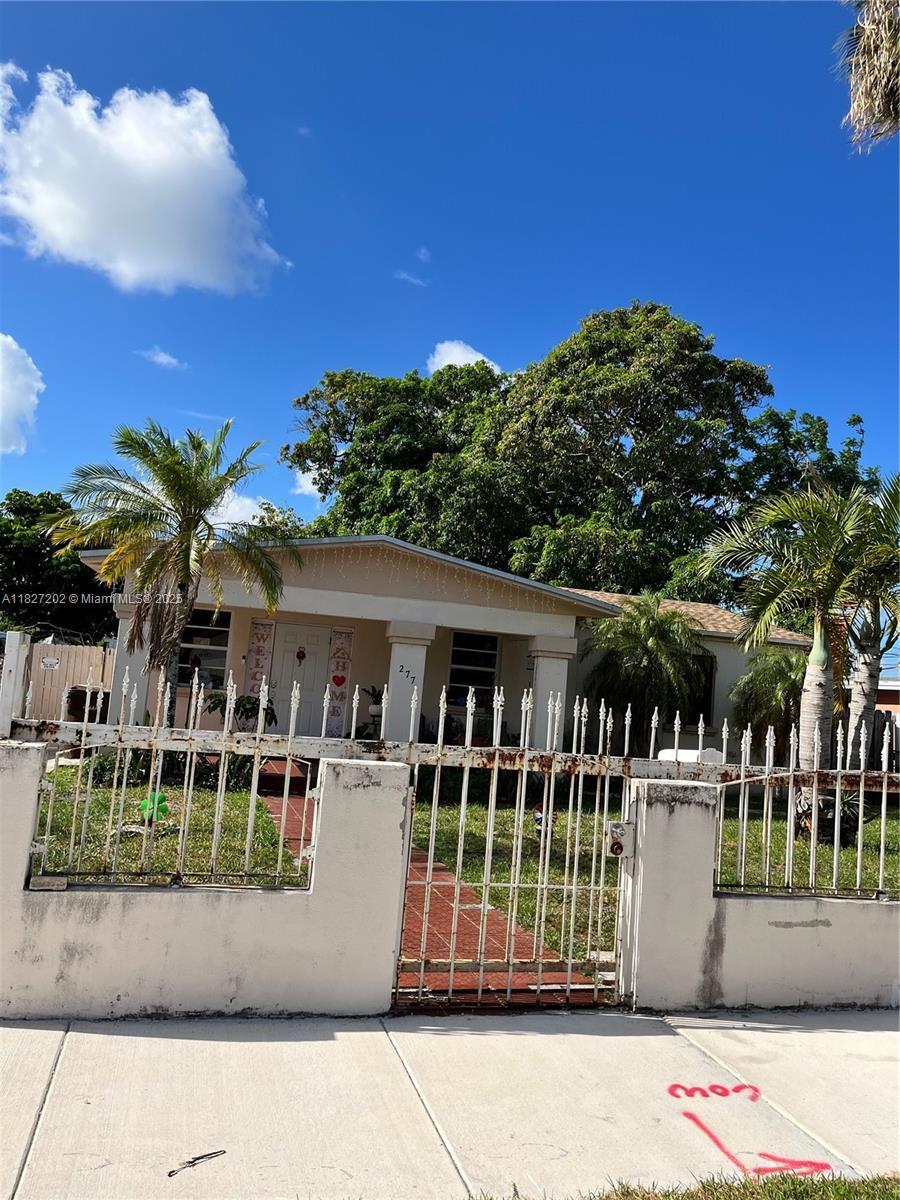 277 E 63rd St, Hialeah, FL 33013 - view of front of house featuring a fenced front yard and a gate