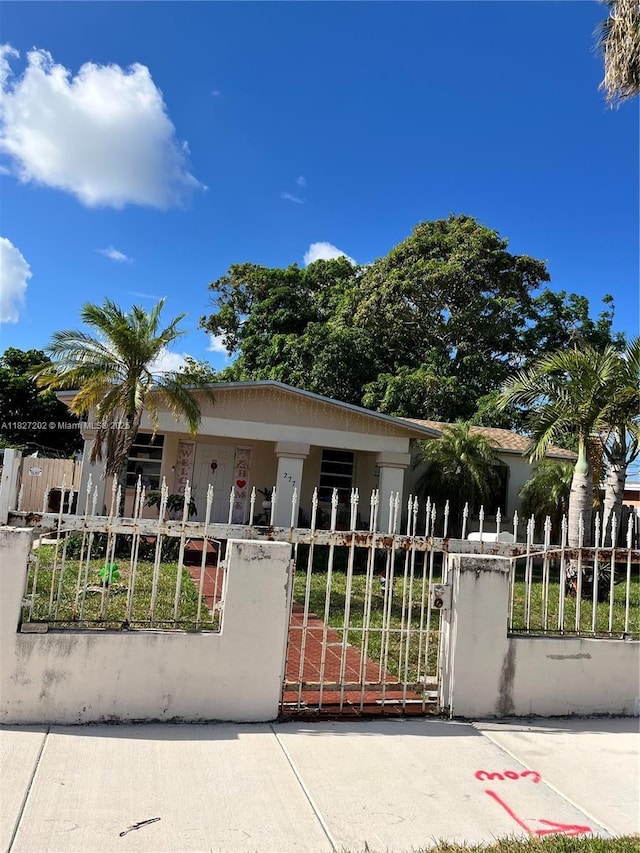 277 E 63rd St, Hialeah, FL 33013 - view of front of house featuring a fenced front yard and a gate