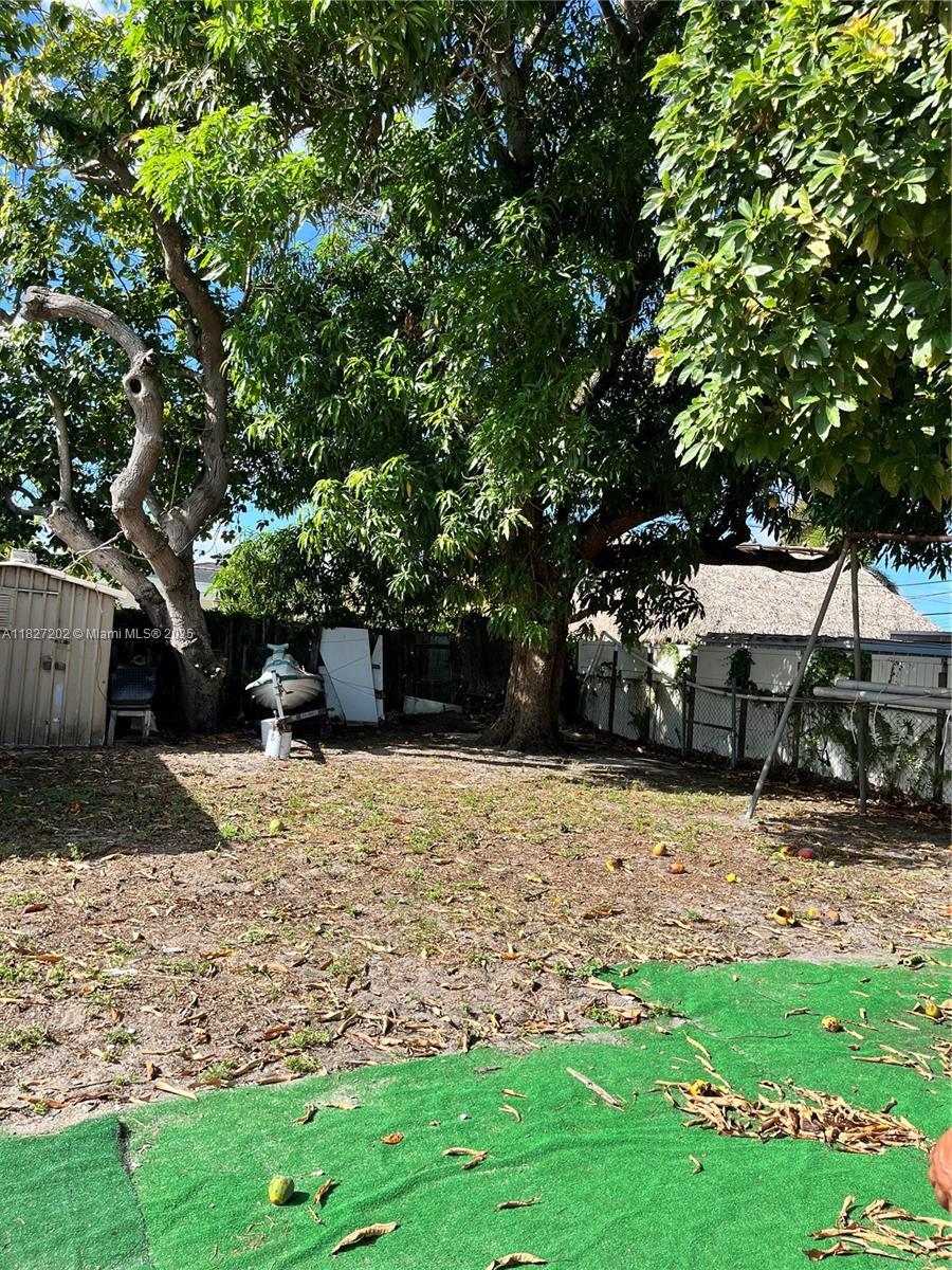 277 E 63rd St, Hialeah, FL 33013 - view of yard featuring a storage unit