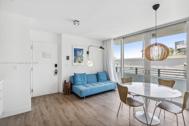 6080 Collins Ave Unit 302, Miami Beach, FL 33140 - dining space featuring light wood finished floors and baseboards