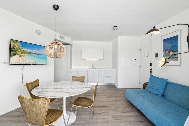 6080 Collins Ave Unit 302, Miami Beach, FL 33140 - dining space with light wood-type flooring and baseboards