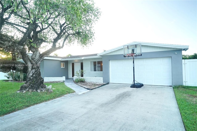 7985 NW 1st St, Margate, FL 33063 - ranch-style home featuring concrete driveway, a garage, and a front yard
