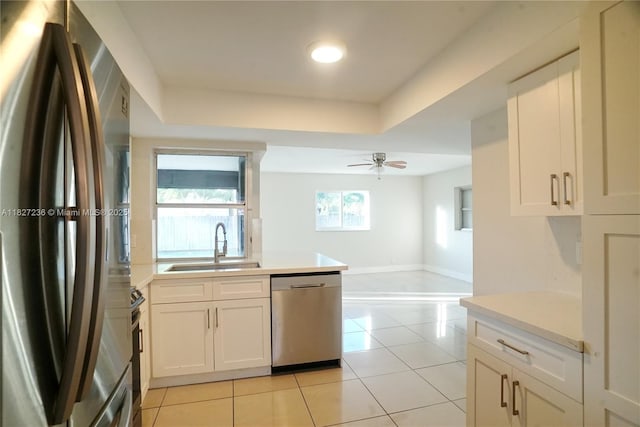 7985 NW 1st St, Margate, FL 33063 - kitchen featuring stainless steel appliances, light tile patterned floors, light countertops, and ceiling fan