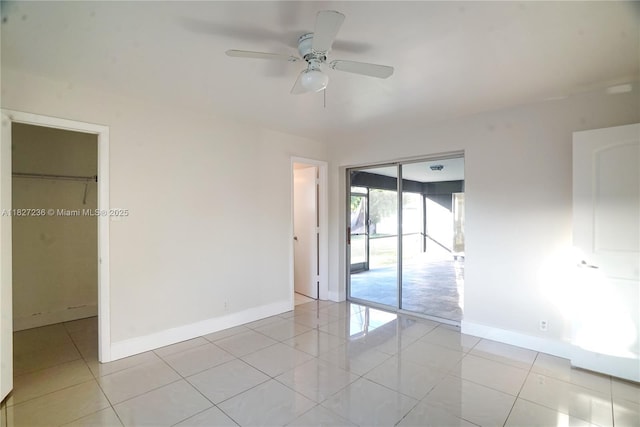 7985 NW 1st St, Margate, FL 33063 - unfurnished bedroom with a closet, light tile patterned flooring, and ceiling fan