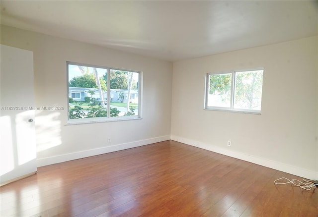 7985 NW 1st St, Margate, FL 33063 - spare room featuring healthy amount of natural light and wood-type flooring
