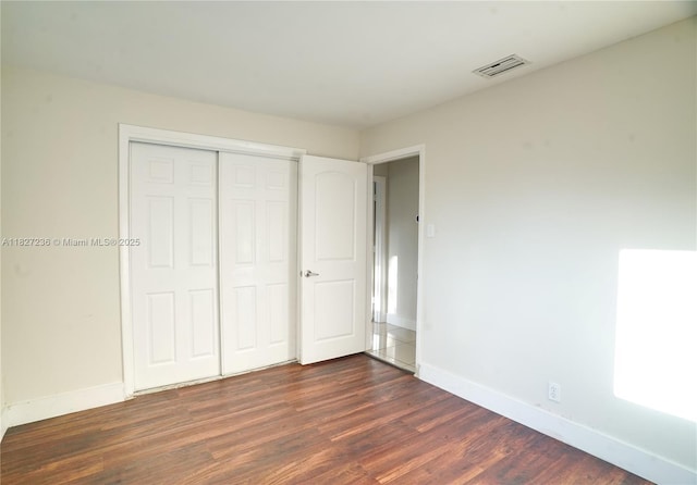 7985 NW 1st St, Margate, FL 33063 - unfurnished bedroom featuring dark wood-type flooring and a closet