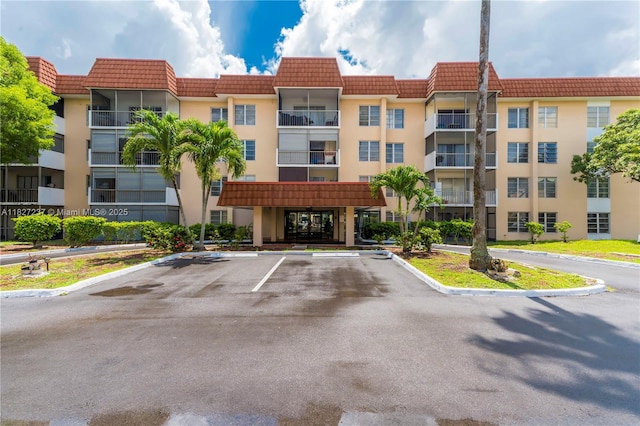 4168 Inverrary Dr Unit 402, Lauderhill, FL 33319 - view of apartment building / complex featuring uncovered parking