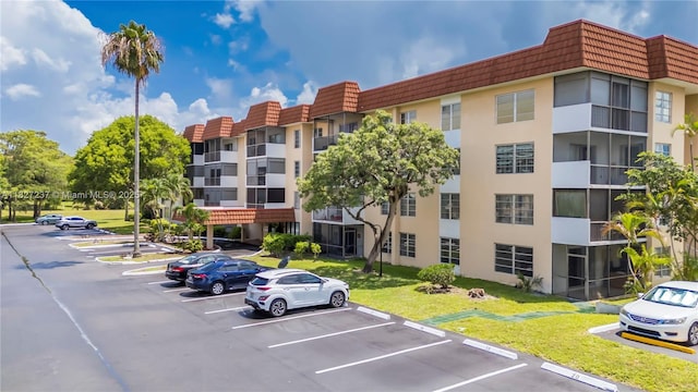 4168 Inverrary Dr Unit 402, Lauderhill, FL 33319 - view of building exterior with uncovered parking