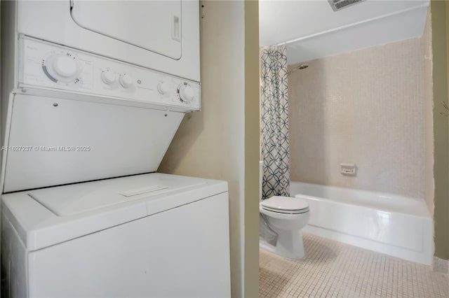 4168 Inverrary Dr Unit 402, Lauderhill, FL 33319 - full bath with stacked washer / dryer, shower / bathtub combination with curtain, and tile patterned floors