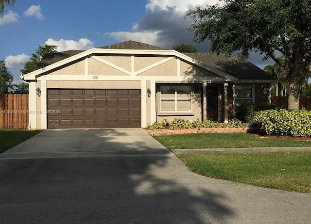 763 S Wind Cir, Sunrise, FL 33326 - ranch-style house with an attached garage, driveway, and stucco siding