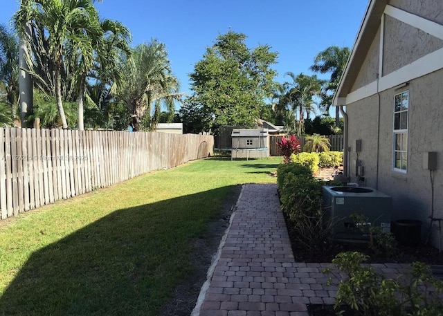 763 S Wind Cir, Sunrise, FL 33326 - fenced backyard featuring a trampoline