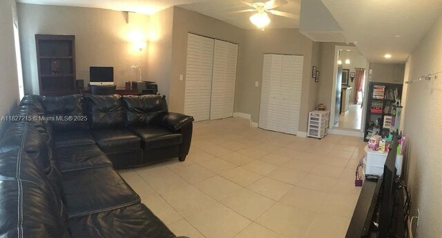763 S Wind Cir, Sunrise, FL 33326 - living area with ceiling fan and light tile patterned flooring