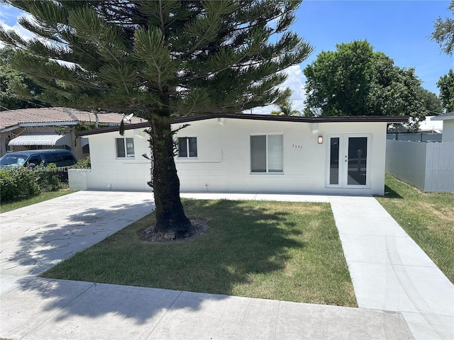 3231 NW 48th Ter, Miami, FL 33142 - ranch-style home with stucco siding and concrete driveway