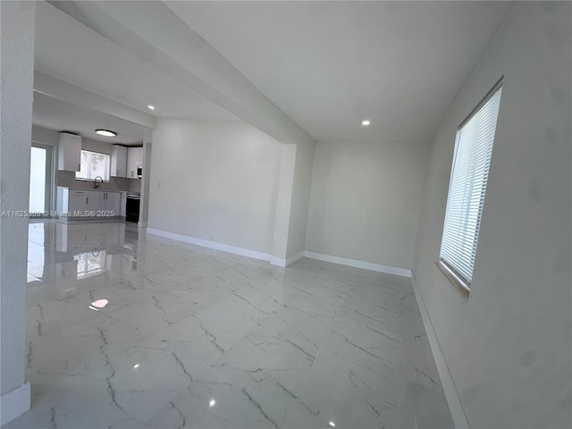 3231 NW 48th Ter, Miami, FL 33142 - unfurnished living room with light marble finish floors and recessed lighting