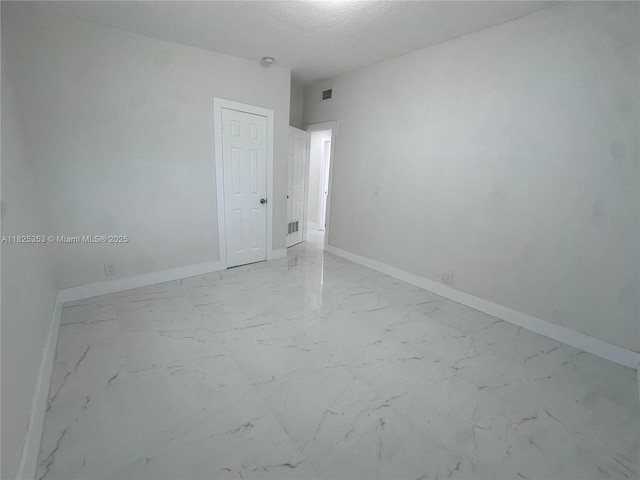 3231 NW 48th Ter, Miami, FL 33142 - unfurnished room featuring marble look tiles