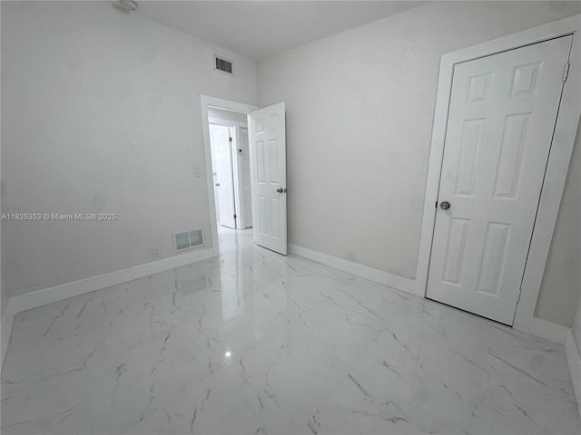 3231 NW 48th Ter, Miami, FL 33142 - unfurnished room featuring marble finish flooring and baseboards