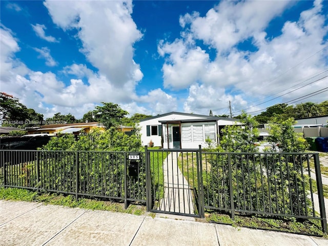 305 SW 24th Ave, Fort Lauderdale, FL 33312 - view of front of house with a fenced front yard and a gate