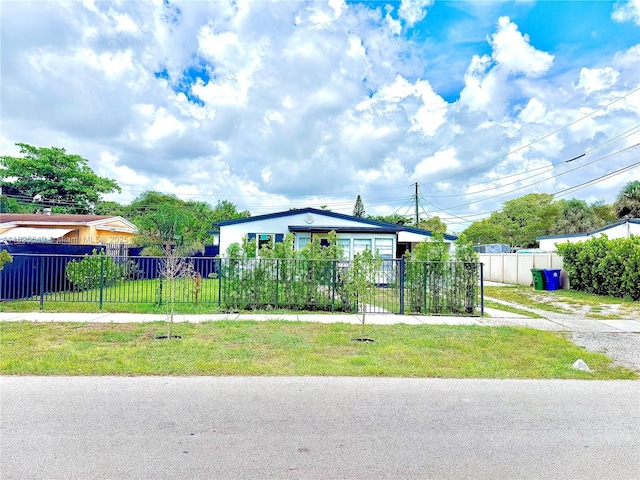 305 SW 24th Ave, Fort Lauderdale, FL 33312 - view of home's community with a fenced front yard and driveway