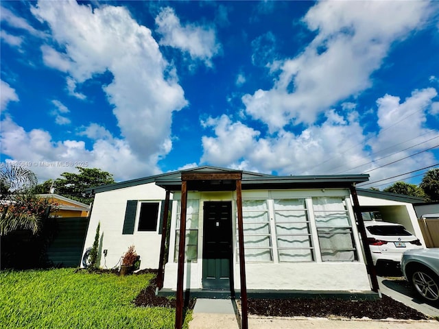 305 SW 24th Ave, Fort Lauderdale, FL 33312 - view of front facade with a carport