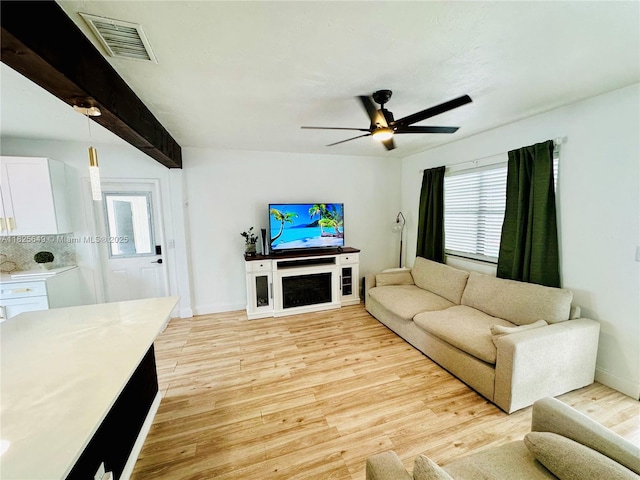 305 SW 24th Ave, Fort Lauderdale, FL 33312 - living area with light wood finished floors and ceiling fan
