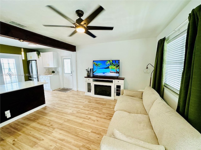 305 SW 24th Ave, Fort Lauderdale, FL 33312 - living room with light wood finished floors, plenty of natural light, ceiling fan, and beam ceiling