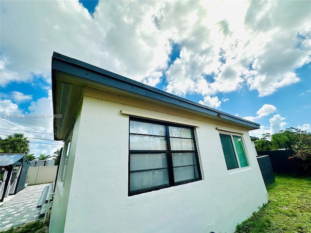 305 SW 24th Ave, Fort Lauderdale, FL 33312 - view of side of home featuring stucco siding