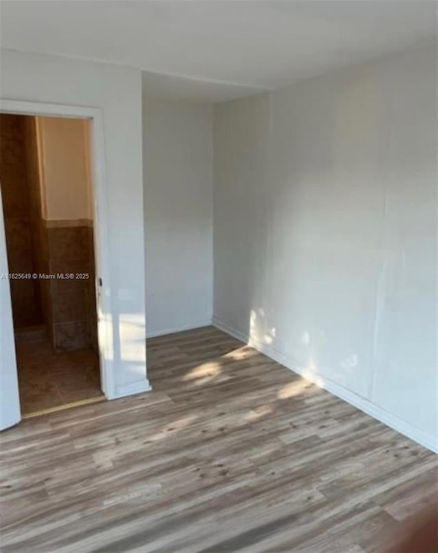 305 SW 24th Ave, Fort Lauderdale, FL 33312 - empty room with wood finished floors and baseboards
