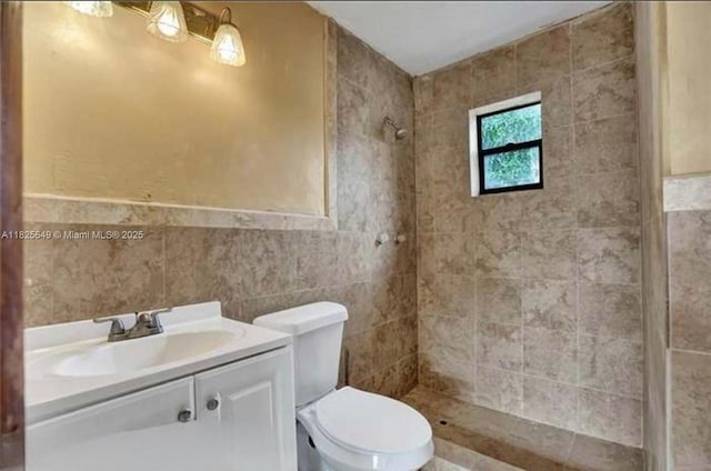 305 SW 24th Ave, Fort Lauderdale, FL 33312 - bathroom with tiled shower, vanity, and tile walls