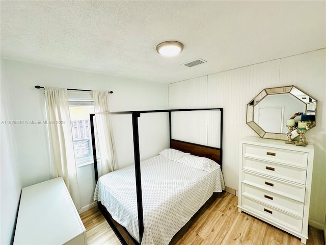 305 SW 24th Ave, Fort Lauderdale, FL 33312 - bedroom with light wood-style flooring and a textured ceiling