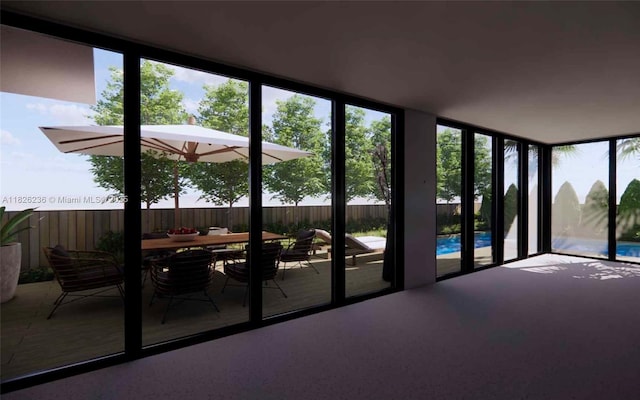 272 NW 59th St Tha, Unit Tha, Miami, FL 33127 - sunroom featuring carpet floors and plenty of natural light