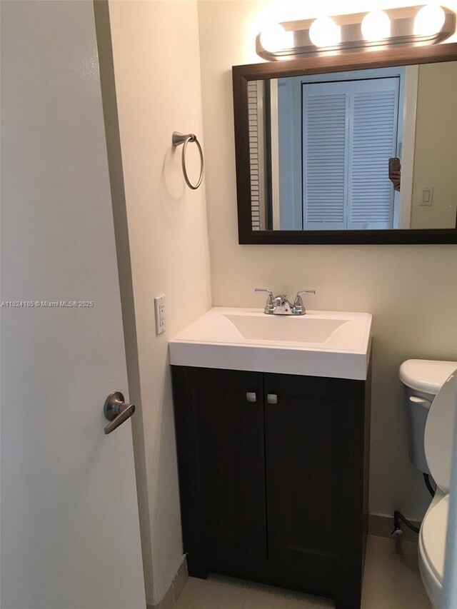 1450 Brickell Bay Dr Unit 311, Miami, FL 33131 - half bathroom with toilet and vanity