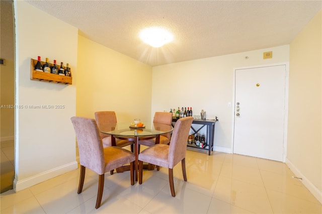 1450 Brickell Bay Dr Unit 311, Miami, FL 33131 - dining room featuring a textured ceiling and baseboards