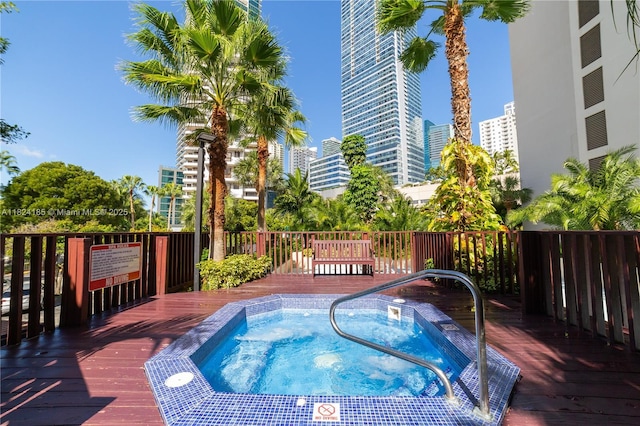 1450 Brickell Bay Dr Unit 311, Miami, FL 33131 - view of swimming pool featuring a deck and a community hot tub