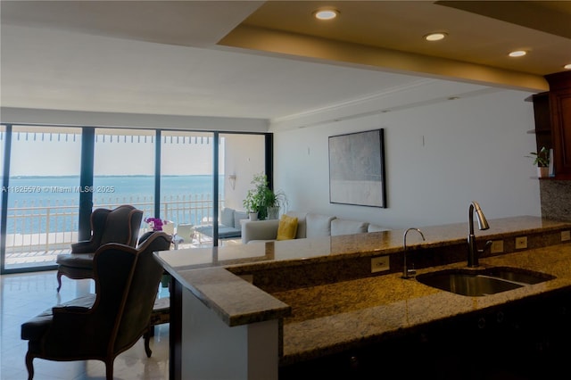 3 Grove Isle Dr Unit C1405, Miami, FL 33133 - kitchen with healthy amount of natural light, stone counters, open floor plan, recessed lighting, and tile patterned flooring