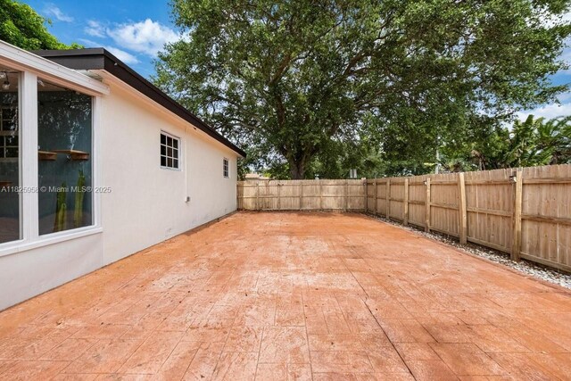 12995 NE 5th Ave, North Miami, FL 33161 - fenced backyard featuring a patio