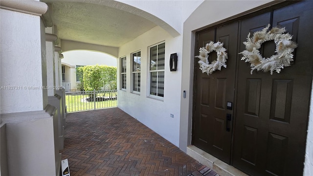 1425 Crossbill Ct, Weston, FL 33327 - property entrance with a porch and stucco siding