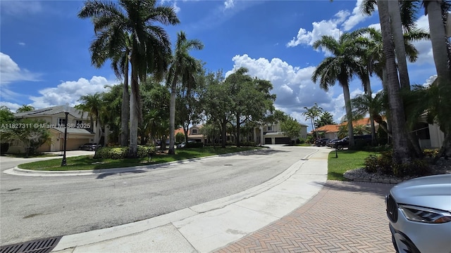 1425 Crossbill Ct, Weston, FL 33327 - view of asphalt street featuring a residential view and curbs