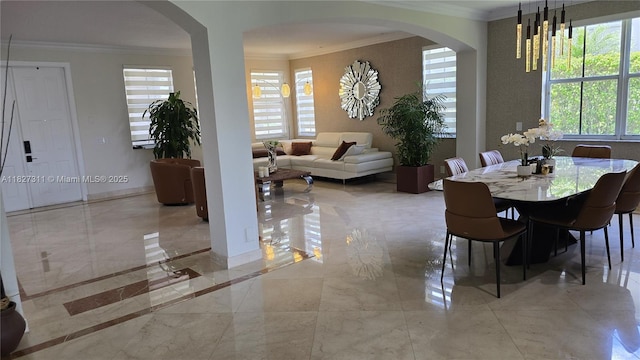 1425 Crossbill Ct, Weston, FL 33327 - dining space featuring ornamental molding, arched walkways, plenty of natural light, and marble tiled flooring