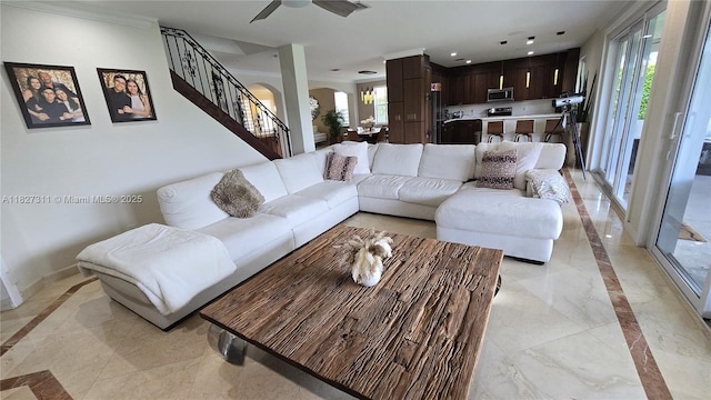 1425 Crossbill Ct, Weston, FL 33327 - living area with inlaid floor details, arched walkways, stairs, light marble finish floors, and a ceiling fan